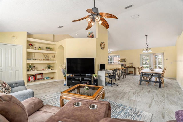 living room featuring vaulted ceiling, a textured ceiling, built in features, and ceiling fan