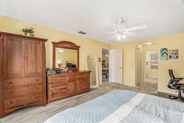 bedroom featuring a textured ceiling and ceiling fan