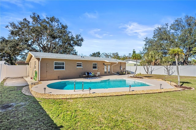 view of pool featuring a yard and a patio area