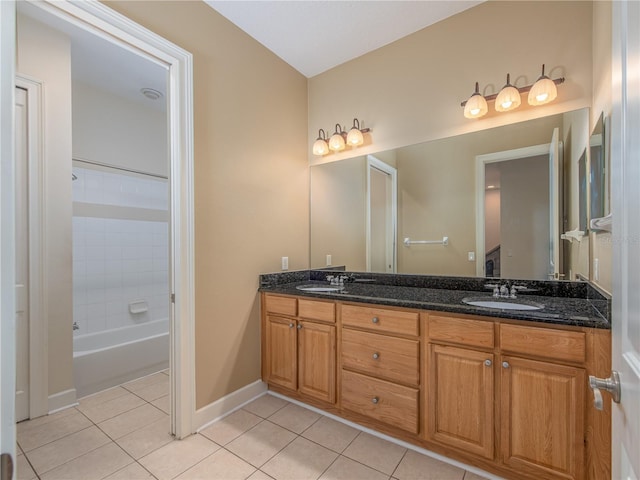 bathroom with vanity, tile patterned floors, and washtub / shower combination