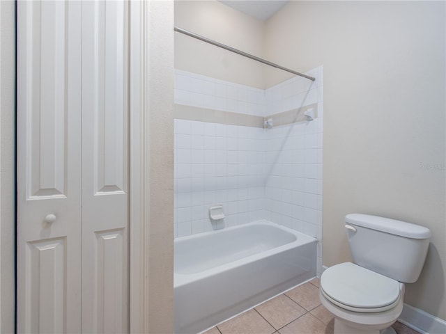 bathroom with shower / tub combination, tile patterned floors, and toilet