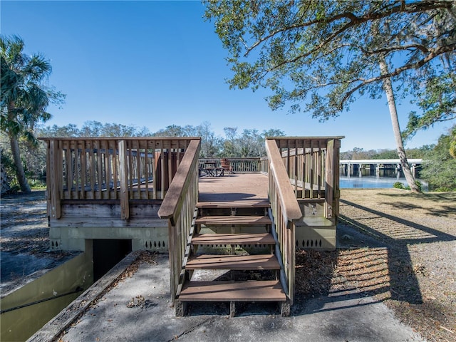 exterior space with a deck with water view