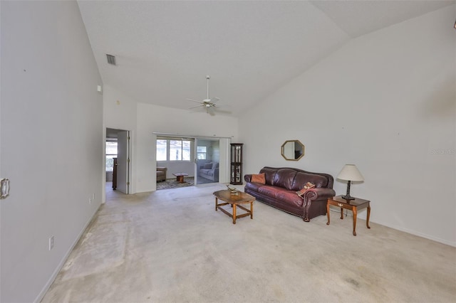 carpeted living room featuring high vaulted ceiling and ceiling fan