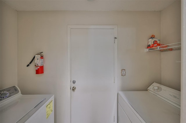 washroom featuring washer and dryer