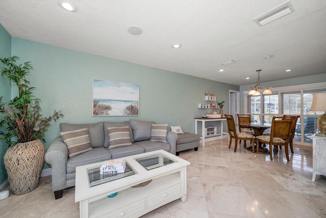 living room featuring a textured ceiling