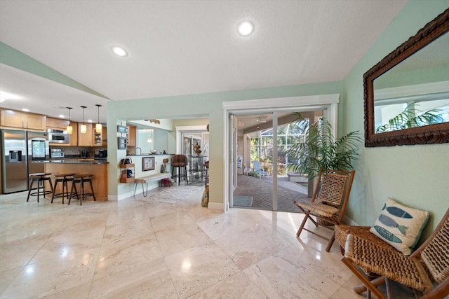 entryway featuring lofted ceiling