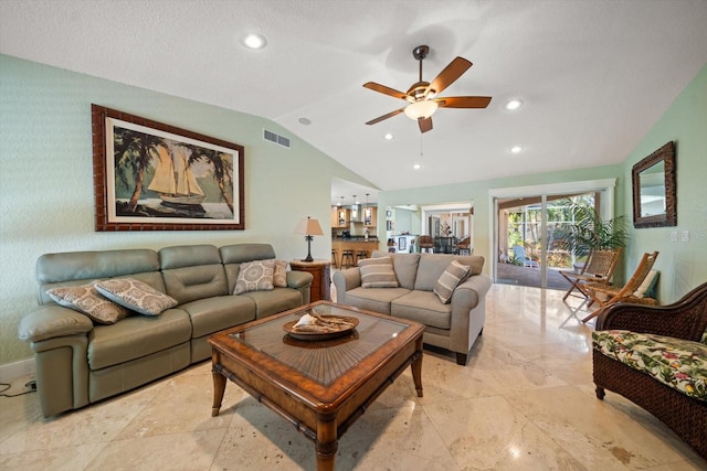 living room featuring ceiling fan and vaulted ceiling