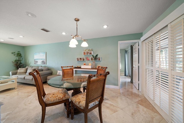 dining room with a textured ceiling