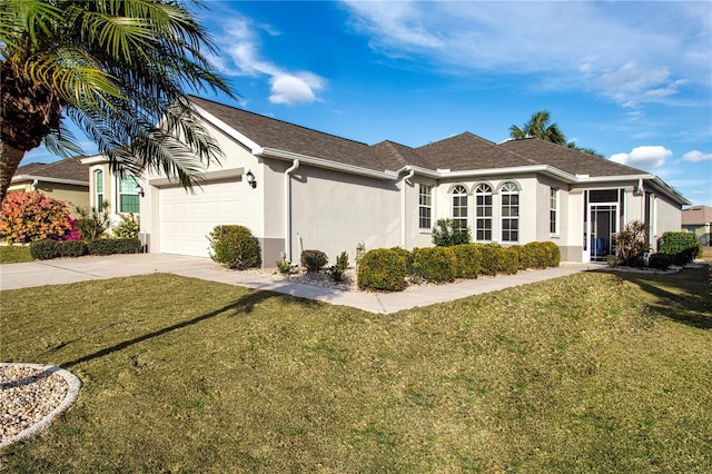 ranch-style house with a garage and a front yard