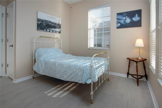 bedroom with wood-type flooring