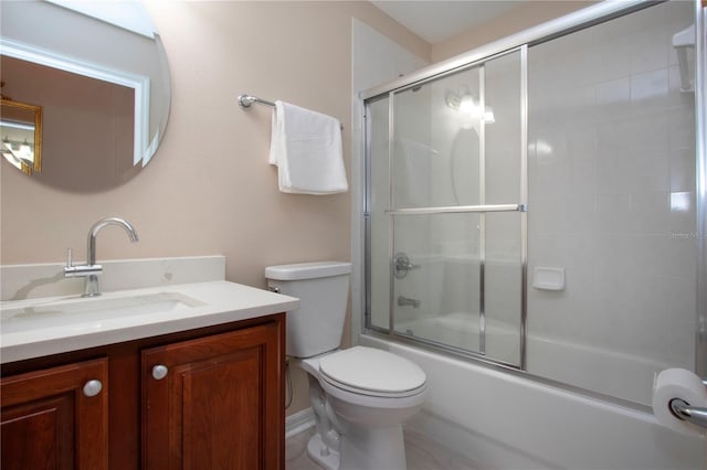 full bathroom featuring toilet, vanity, and shower / bath combination with glass door