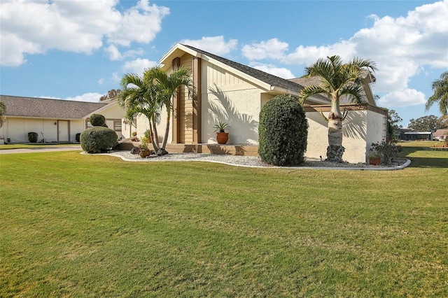 view of home's exterior featuring a yard