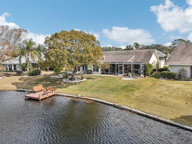 dock area featuring a water view and a yard