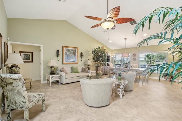 tiled living room featuring ceiling fan and lofted ceiling