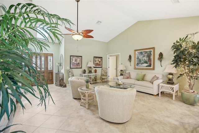 living room with ceiling fan, light tile patterned floors, and high vaulted ceiling