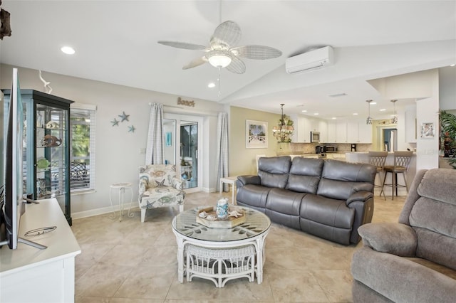 living room featuring ceiling fan, light tile patterned floors, vaulted ceiling, and an AC wall unit