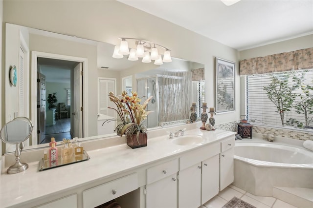 bathroom with independent shower and bath, vanity, and tile patterned floors