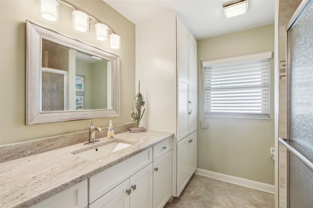 bathroom with vanity and tile patterned floors