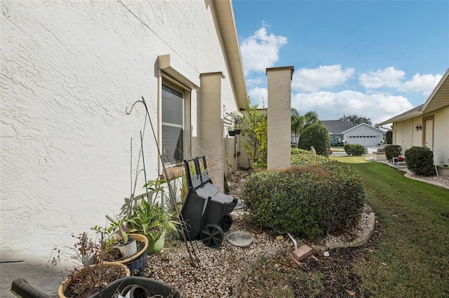 view of home's exterior with a lawn