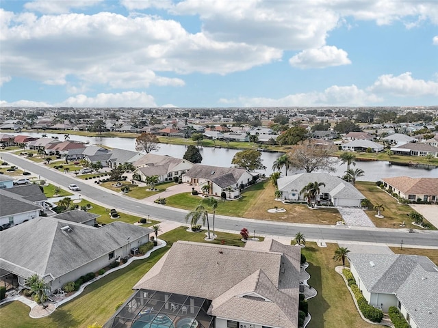 birds eye view of property with a water view