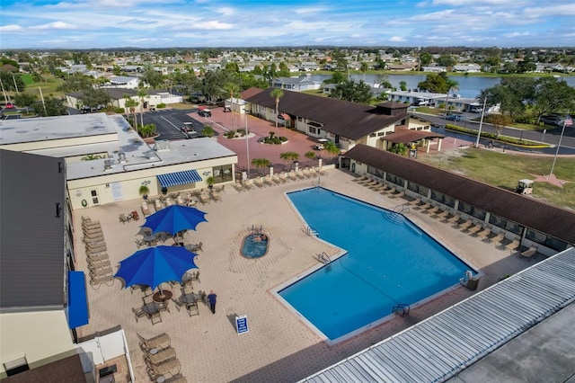 view of swimming pool with a water view