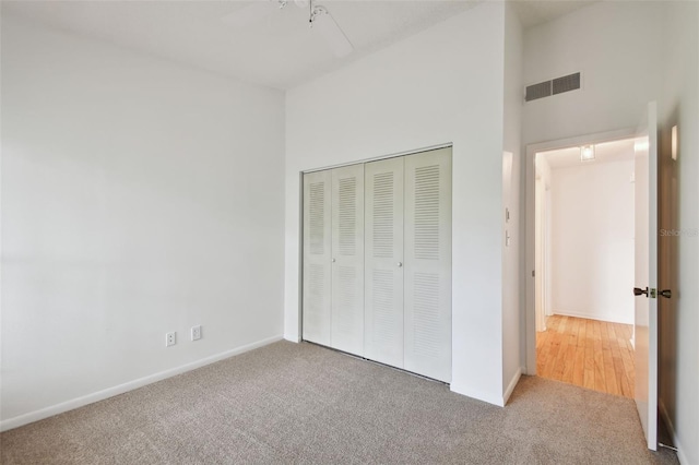 unfurnished bedroom featuring a closet and carpet