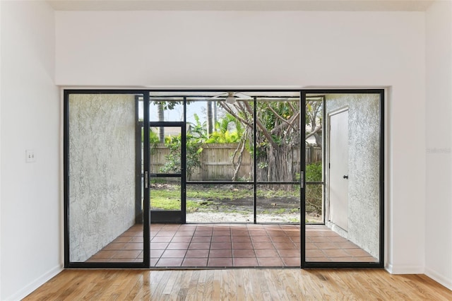 entryway with wood-type flooring and a wealth of natural light