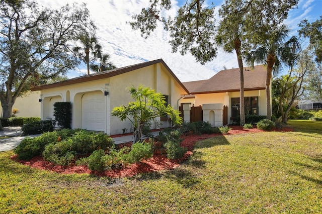 view of front of home with a garage and a front yard