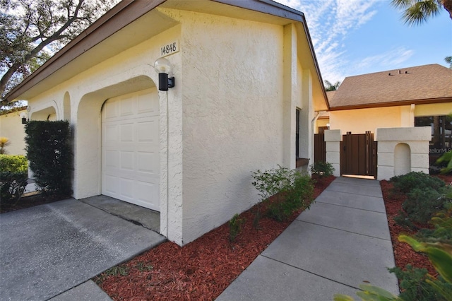 view of property exterior featuring a garage