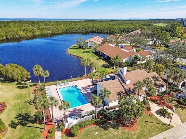 birds eye view of property with a water view