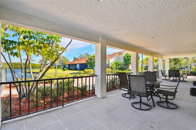 view of patio / terrace with a water view