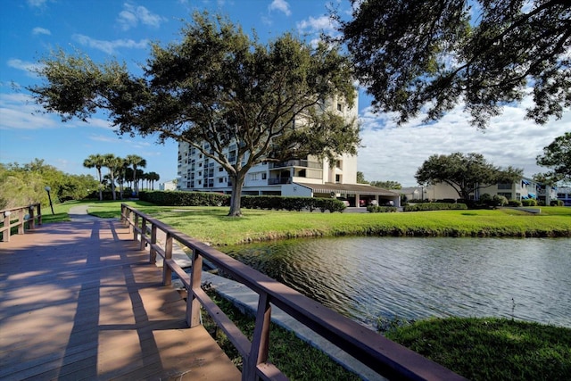 dock area featuring a water view and a yard