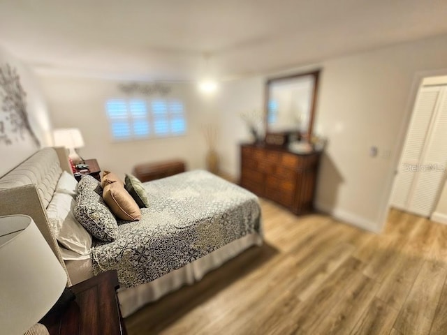 bedroom with light hardwood / wood-style floors