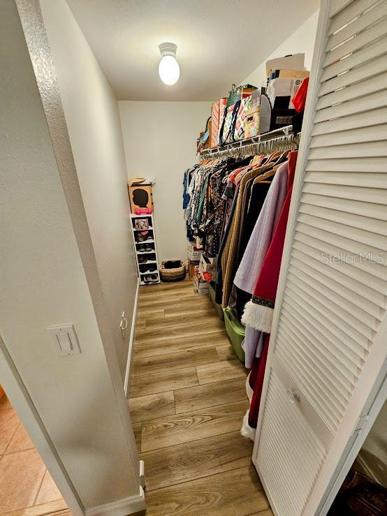 spacious closet featuring light wood-type flooring