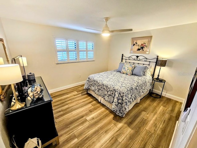 bedroom featuring hardwood / wood-style flooring and ceiling fan