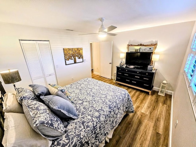 bedroom featuring wood-type flooring, a closet, and ceiling fan