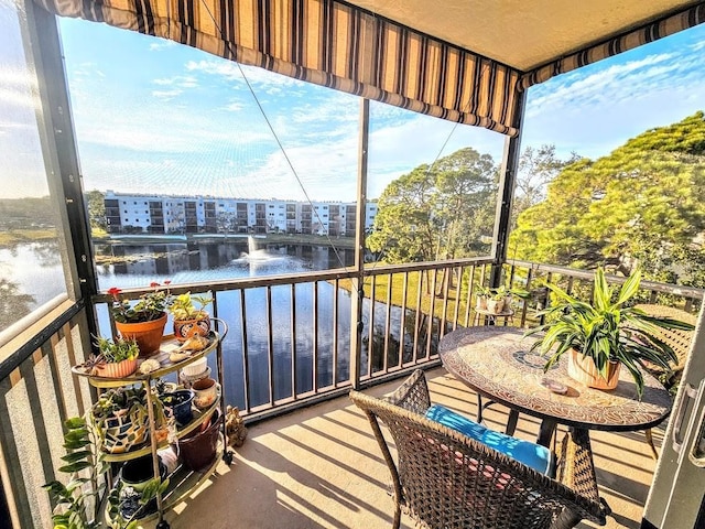 balcony featuring a water view