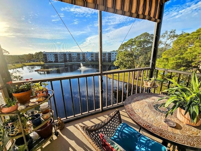 balcony featuring a water view