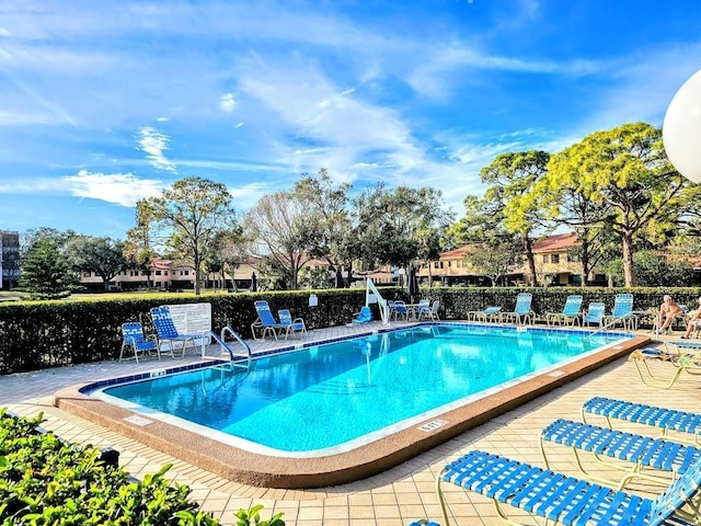 view of swimming pool with a patio area