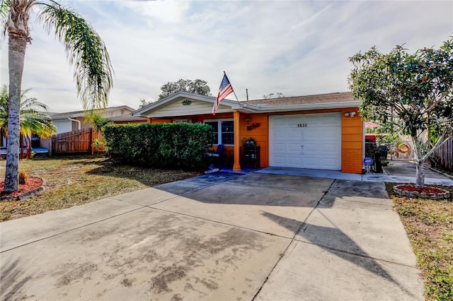 single story home featuring a garage