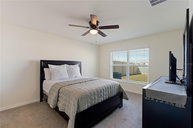 bedroom with light carpet and ceiling fan