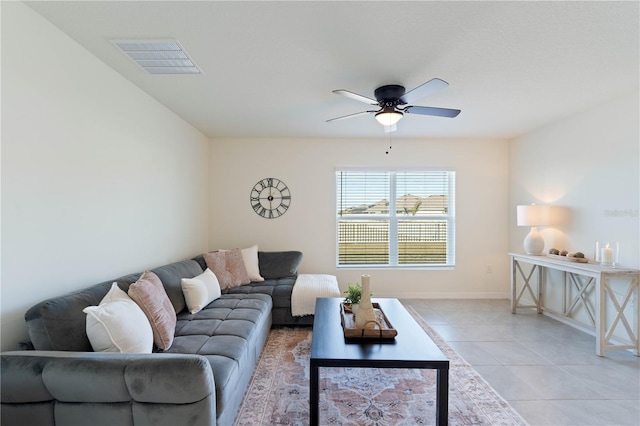 living room featuring light tile patterned flooring and ceiling fan