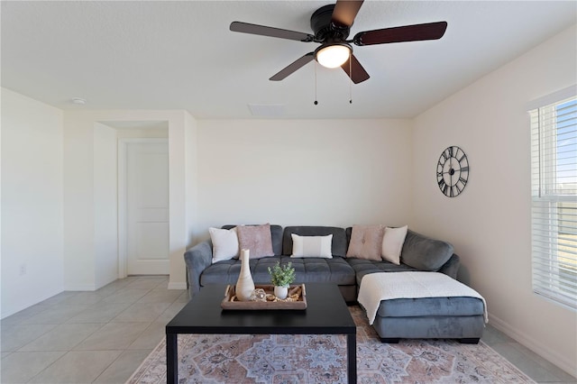 living room with light tile patterned flooring and ceiling fan