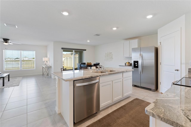 kitchen featuring white cabinetry, an island with sink, appliances with stainless steel finishes, and sink