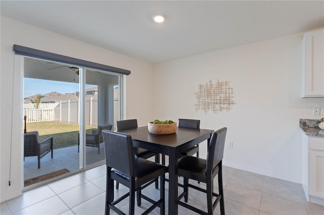 dining space featuring light tile patterned flooring