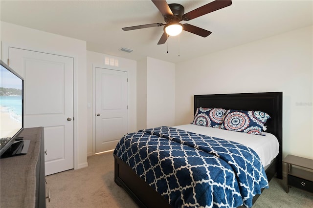 carpeted bedroom with ceiling fan