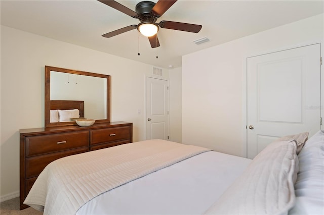 bedroom with ceiling fan and carpet floors