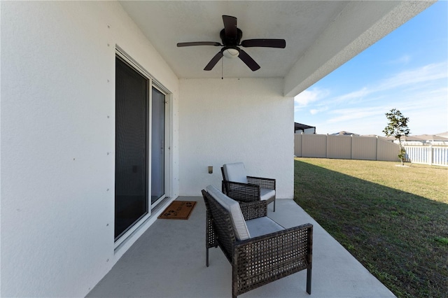 view of patio featuring ceiling fan