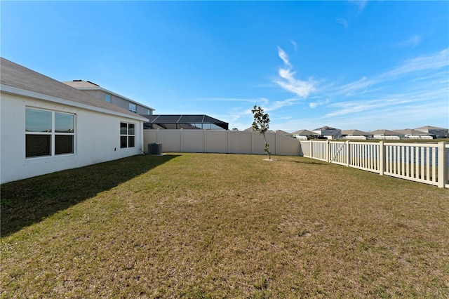 view of yard featuring central AC