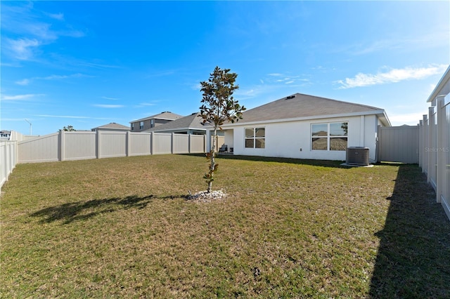 view of yard with central AC